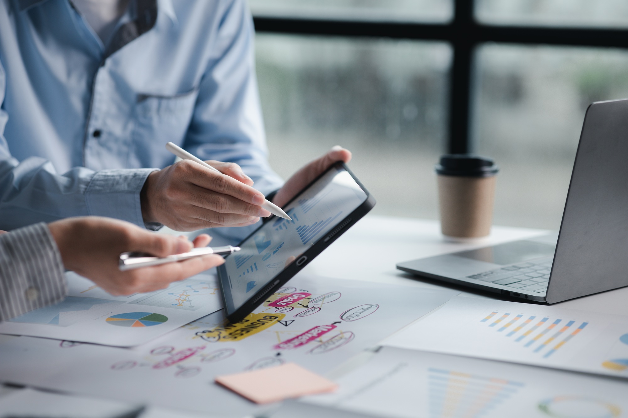 A meeting of two businessmen brainstorming a marketing plan.